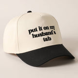 Put It On My Husband's Tab Trucker Hat